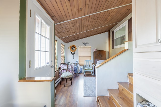 interior space with a baseboard heating unit, wood ceiling, vaulted ceiling, and hardwood / wood-style flooring