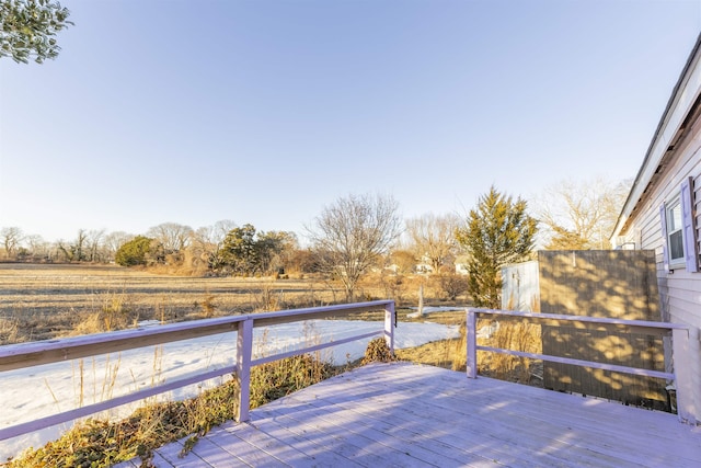 wooden terrace with a rural view