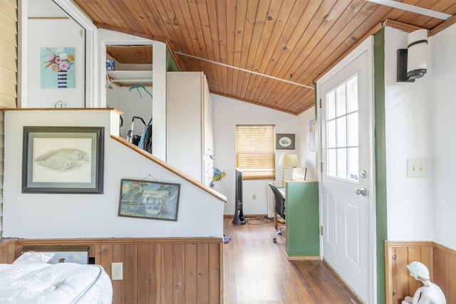 entryway featuring hardwood / wood-style flooring, vaulted ceiling, and wooden ceiling