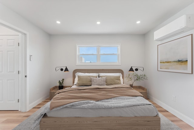 2001 Surf Ave Unit 2, North Wildwood, NJ 08260 - bedroom featuring a wall unit AC, baseboards, light wood-type flooring, and recessed lighting