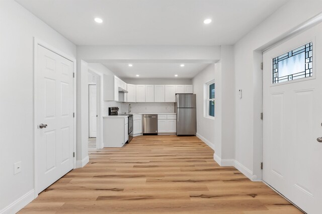 2001 Surf Ave Unit 2, North Wildwood, NJ 08260 - kitchen featuring stainless steel appliances, healthy amount of natural light, light countertops, white cabinets, and recessed lighting