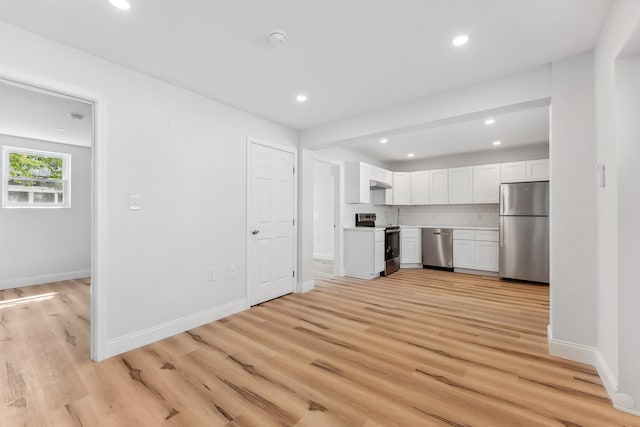 2001 Surf Ave Unit 2, North Wildwood, NJ 08260 - kitchen featuring stainless steel appliances, white cabinets, light wood finished floors, light countertops, and recessed lighting
