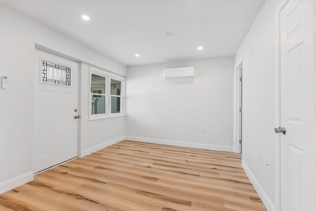 2001 Surf Ave Unit 2, North Wildwood, NJ 08260 - foyer with recessed lighting, light wood-style flooring, an AC wall unit, and baseboards