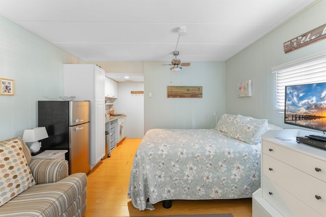 1800 Atlantic Ave Unit 103, North Wildwood, NJ 08260 - bedroom featuring freestanding refrigerator, light wood-style floors, and ceiling fan