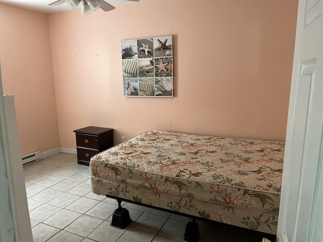 tiled bedroom featuring ceiling fan and a baseboard radiator