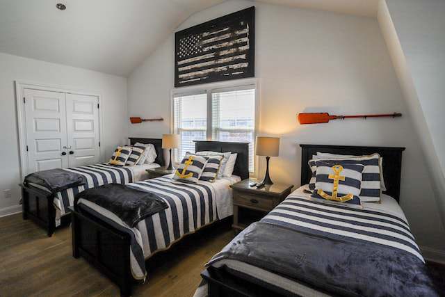 bedroom featuring baseboards, high vaulted ceiling, and dark wood-type flooring