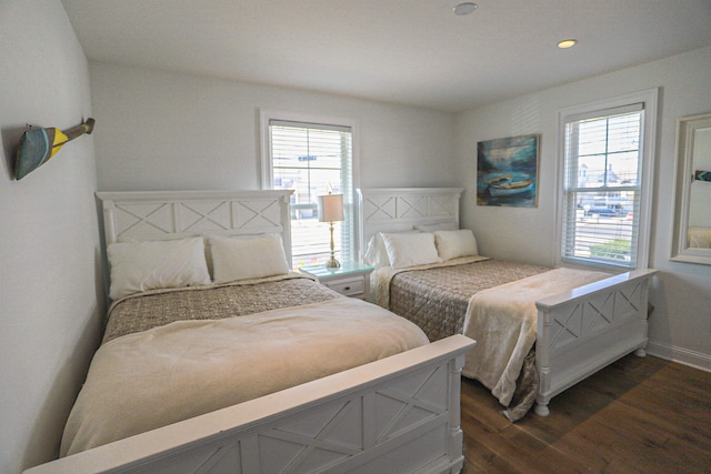 bedroom featuring baseboards, dark wood-type flooring, and recessed lighting