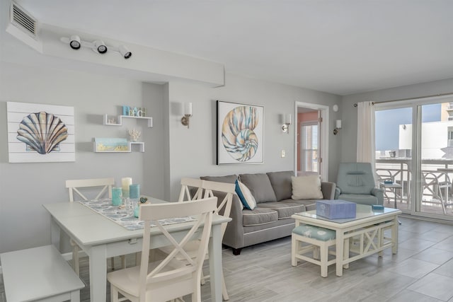 living area featuring visible vents