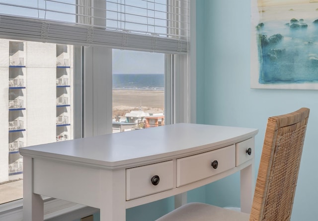 details featuring a view of the beach and a water view
