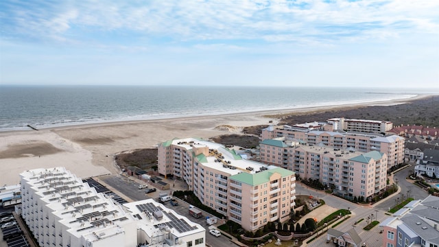 bird's eye view featuring a view of the beach and a water view