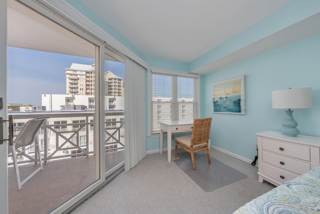 bedroom featuring baseboards and carpet