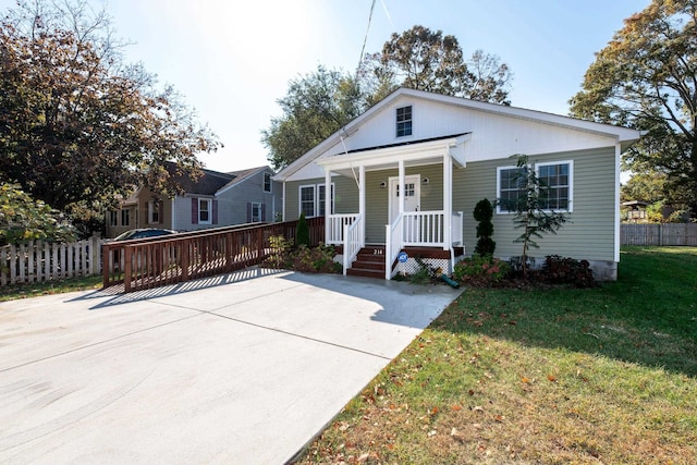 bungalow featuring a porch and a front yard