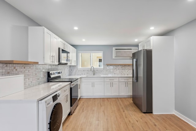 401 Ocean Ave Unit 202, North Wildwood, NJ 08251 - kitchen with stainless steel appliances, washer / dryer, a sink, light wood finished floors, and recessed lighting