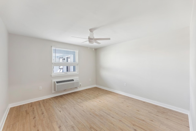 401 Ocean Ave Unit 202, North Wildwood, NJ 08251 - spare room with a wall mounted AC, light wood-style flooring, ceiling fan, and baseboards