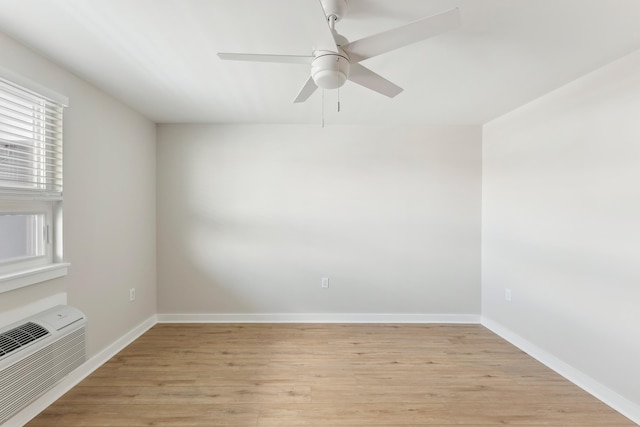 401 Ocean Ave Unit 202, North Wildwood, NJ 08251 - spare room with light wood finished floors, ceiling fan, baseboards, and an AC wall unit