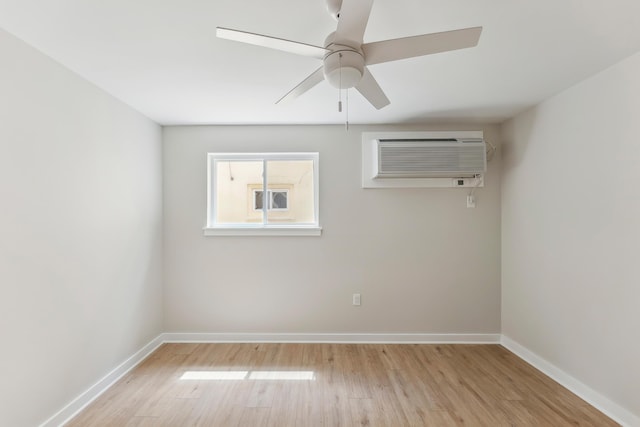 401 Ocean Ave Unit 202, North Wildwood, NJ 08251 - unfurnished room with light wood-style floors, baseboards, a ceiling fan, and a wall mounted AC