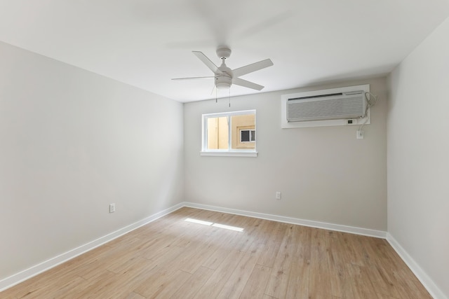 401 Ocean Ave Unit 202, North Wildwood, NJ 08251 - spare room featuring a wall mounted AC, baseboards, light wood-style flooring, and a ceiling fan