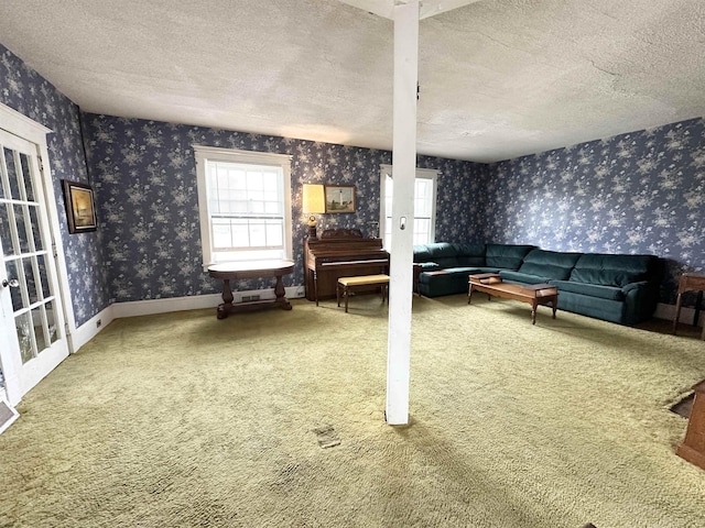 1083 Seashore Rd, Cold Spring, NJ 08204 - living area featuring wallpapered walls, a textured ceiling, and carpet floors