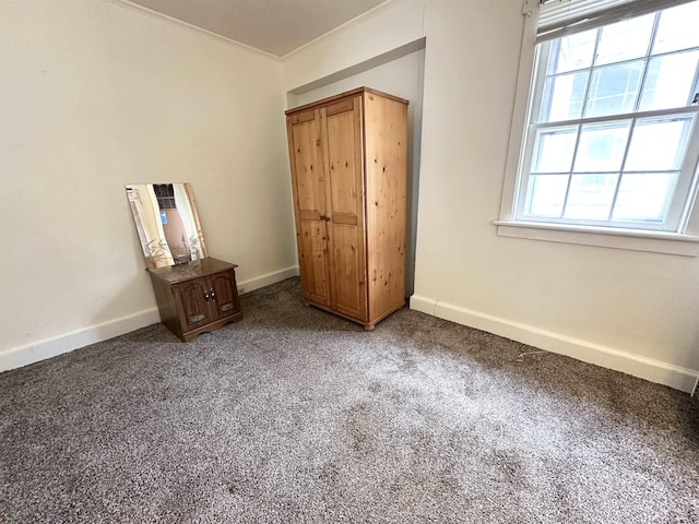 1083 Seashore Rd, Cold Spring, NJ 08204 - unfurnished bedroom featuring baseboards, light colored carpet, and crown molding