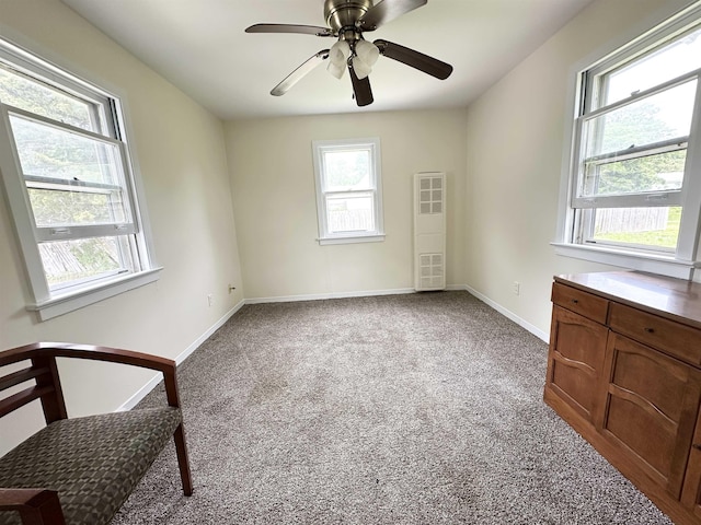 1083 Seashore Rd, Cold Spring, NJ 08204 - empty room with carpet flooring, a ceiling fan, and baseboards