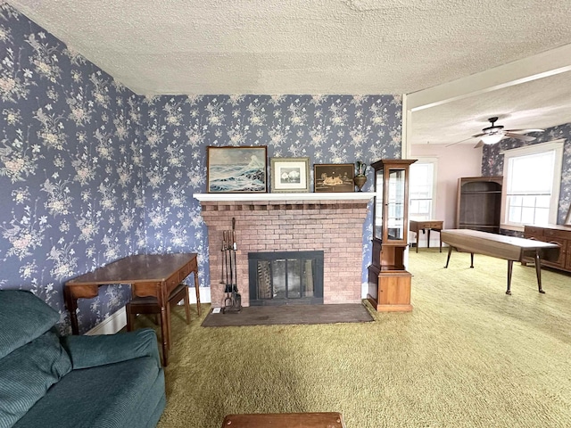 1083 Seashore Rd, Cold Spring, NJ 08204 - carpeted living area with wallpapered walls, a textured ceiling, a fireplace, and ceiling fan