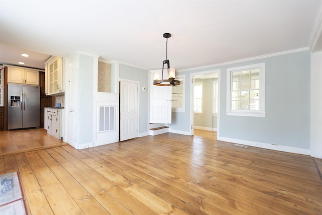 837 Seashore Rd, Lower Township, NJ 08204 - interior space featuring crown molding, an inviting chandelier, baseboards, light wood-type flooring, and visible vents