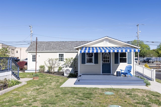 837 Seashore Rd, Lower Township, NJ 08204 - back of property featuring a lawn, roof with shingles, fence, and a deck