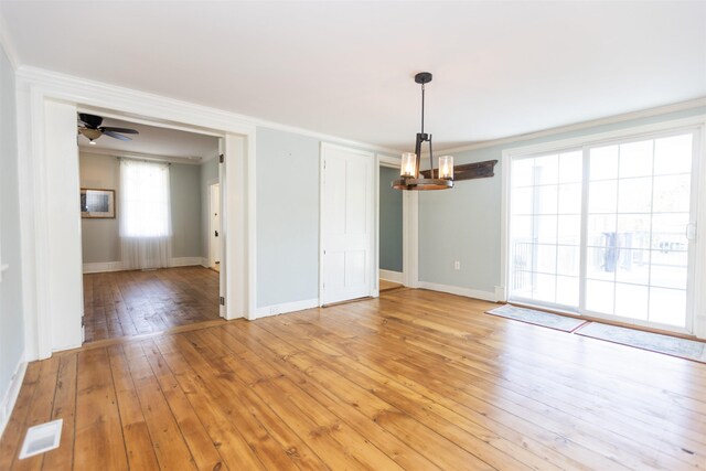 837 Seashore Rd, Lower Township, NJ 08204 - interior space with crown molding, visible vents, baseboards, light wood-type flooring, and ceiling fan with notable chandelier