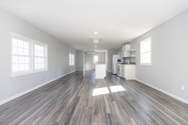 837 Seashore Rd, Lower Township, NJ 08204 - unfurnished living room with baseboards, dark wood-style floors, and attic access