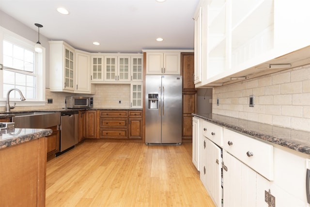 837 Seashore Rd, Lower Township, NJ 08204 - kitchen featuring a sink, light wood finished floors, tasteful backsplash, and stainless steel appliances
