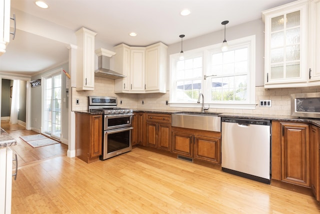 837 Seashore Rd, Lower Township, NJ 08204 - kitchen featuring a sink, light wood-style flooring, brown cabinets, and stainless steel appliances
