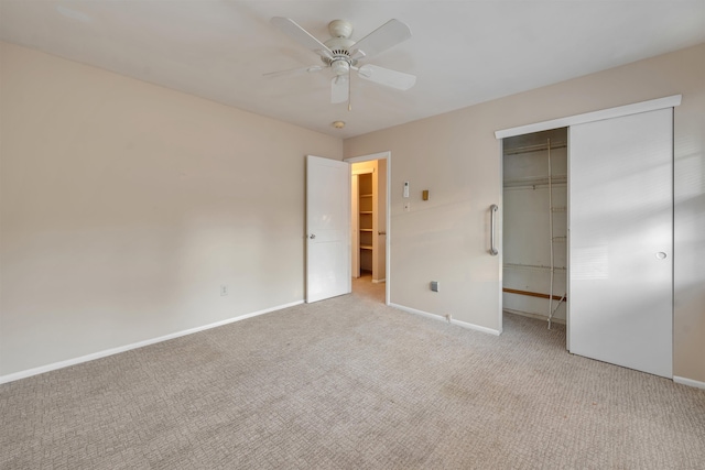 unfurnished bedroom featuring a closet, ceiling fan, and light colored carpet