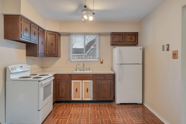 kitchen with white appliances and sink