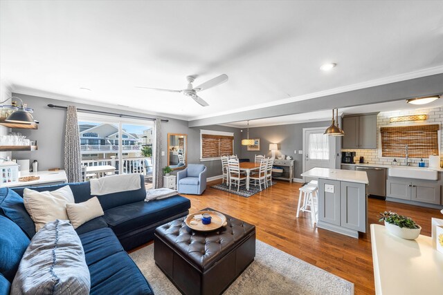 630 21st St Fl 2Nd, Avalon, NJ 08202 - living room featuring healthy amount of natural light, crown molding, wood finished floors, and ceiling fan