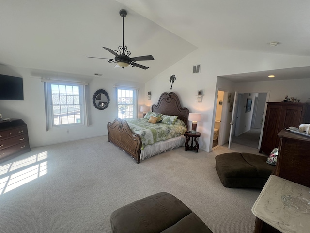 carpeted bedroom with vaulted ceiling and ceiling fan