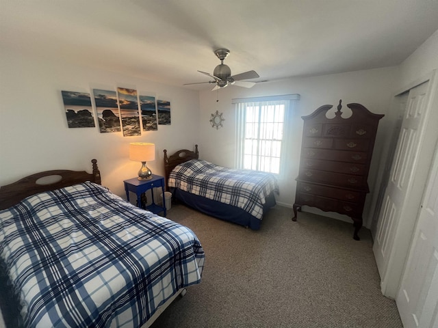 carpeted bedroom with ceiling fan