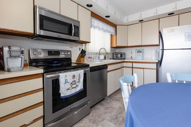 117B W Topeka Ave Unit B, Wildwood Crest, NJ 08260 - kitchen with appliances with stainless steel finishes, light countertops, and white cabinetry
