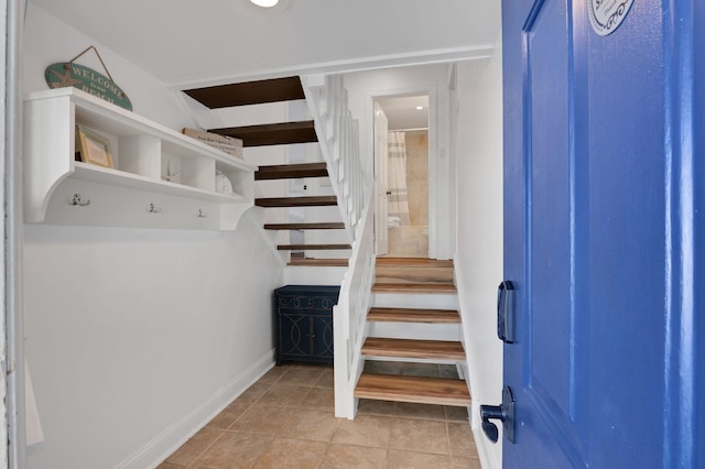 foyer entrance featuring light tile patterned floors