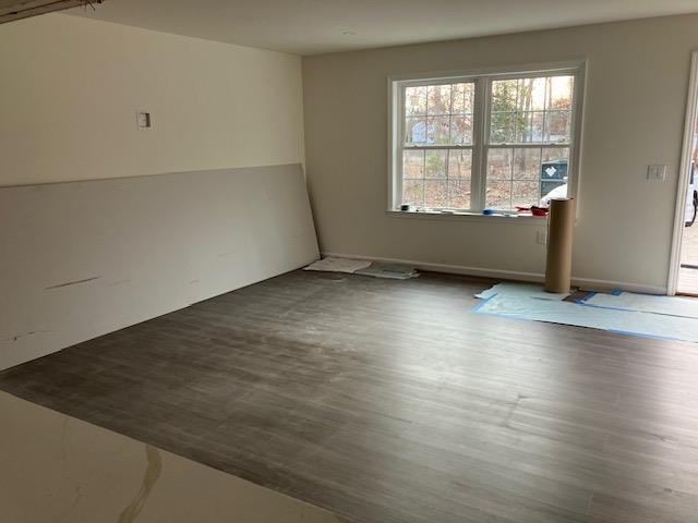 empty room with wood finished floors