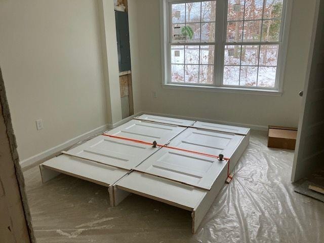 bedroom featuring baseboards