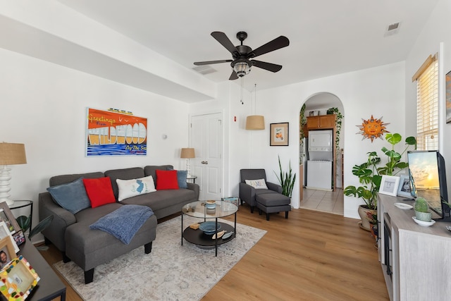 living room featuring ceiling fan and light wood-type flooring