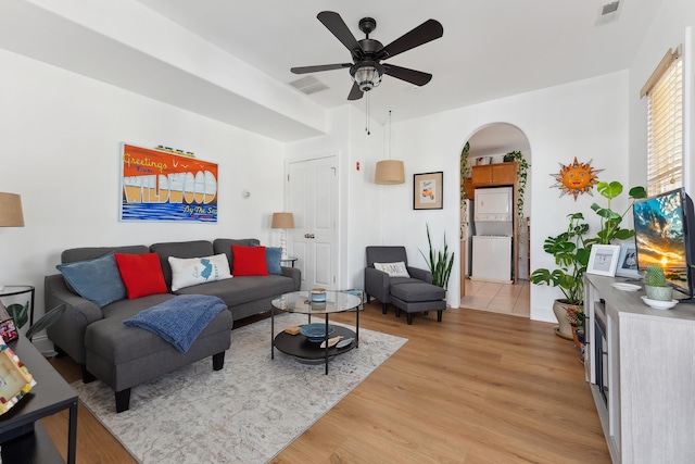 living room featuring light hardwood / wood-style flooring and ceiling fan