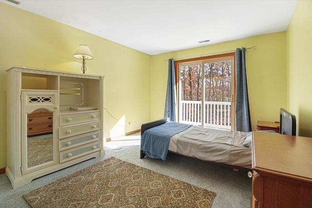 bedroom with carpet flooring, visible vents, and baseboards