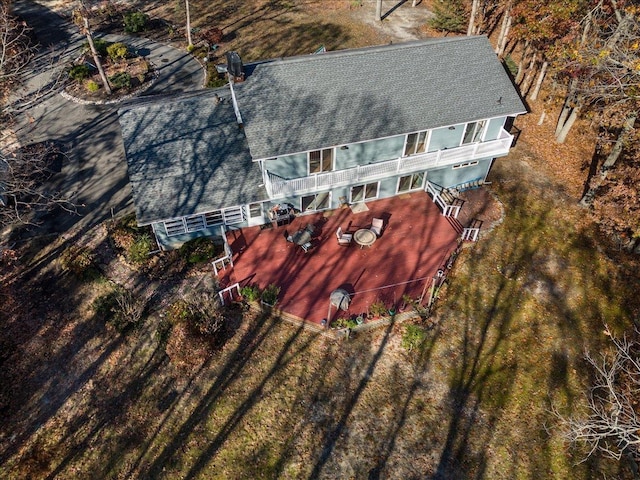 view of front of home with a chimney, a storage unit, an outbuilding, and a front yard