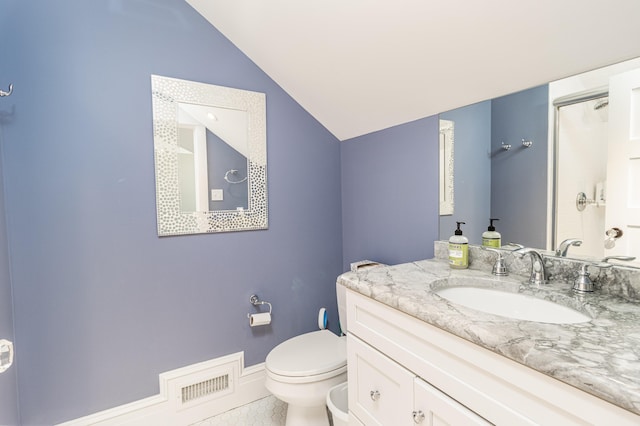 bathroom with toilet, baseboards, visible vents, and vaulted ceiling