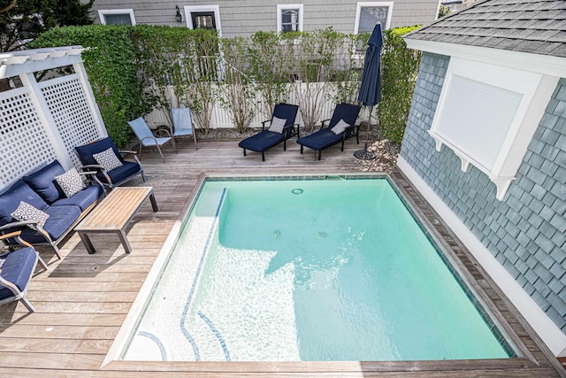 view of pool featuring a wooden deck