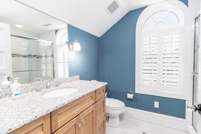 bathroom featuring a wealth of natural light, visible vents, vaulted ceiling, and a shower stall