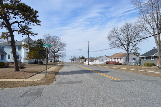 view of road with sidewalks and a residential view