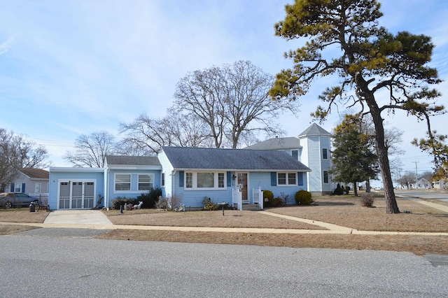 view of front facade featuring a garage and concrete driveway