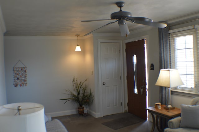 entrance foyer featuring ornamental molding and baseboards